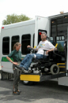 disabled individual being helped into van