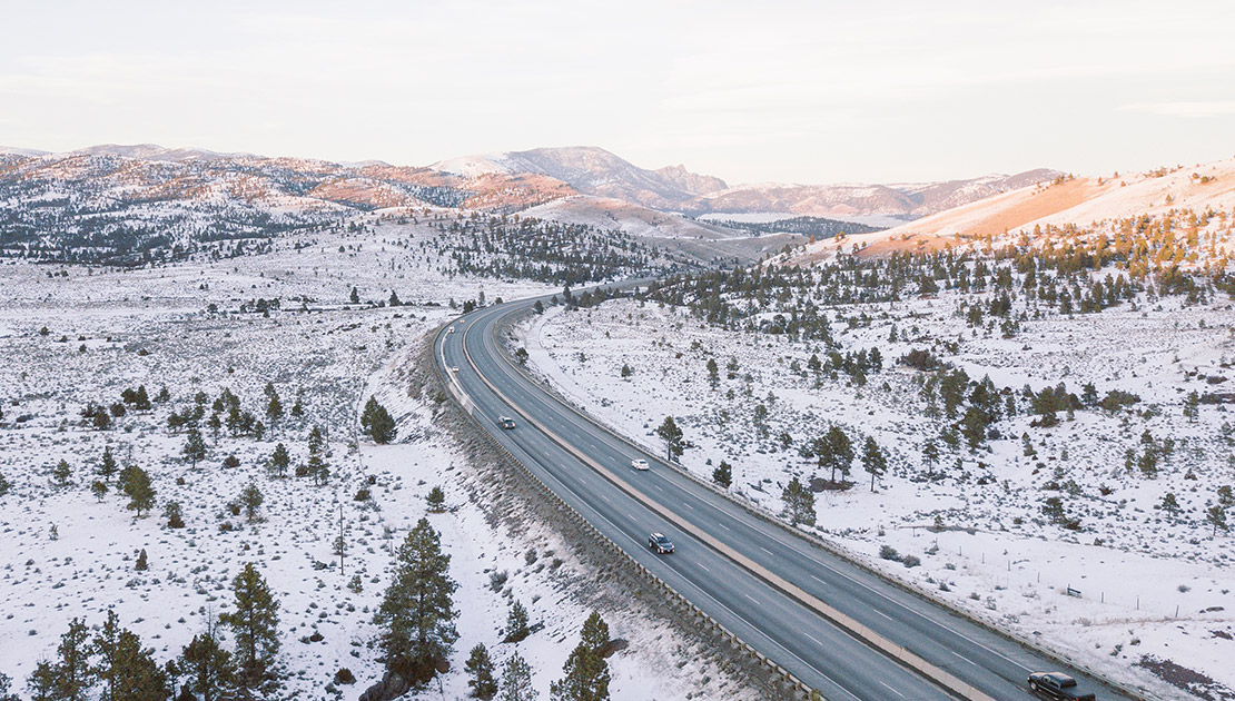 Drone view overlooking I 90 north of Helena in the winter