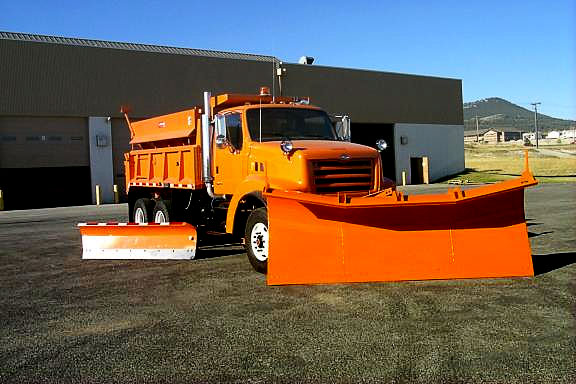 A brand new tandem-axle snowplow truck
