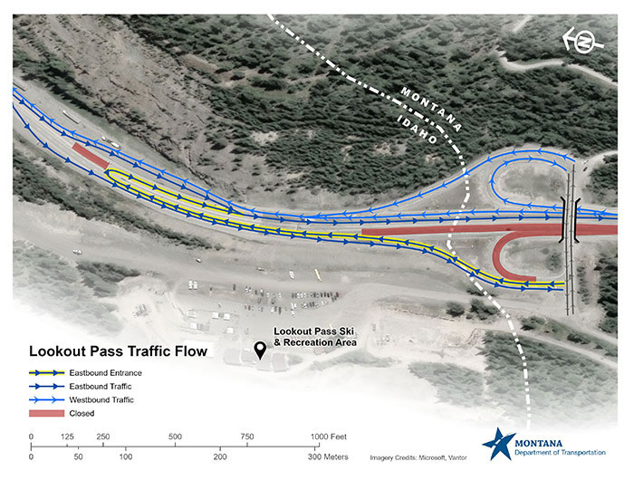 Traffic patterns on I-90 at Lookout Pass will remain changed during the construction project. All traffic will be moved to the westbound lanes. Eastbound ramp traffic at Lookout Pass will be utilizing the eastbound off ramp. Watch the signs and be mindful of the direction of travel on the ramp. For the most up-to-date information regarding road conditions, visit 511mt.net. The image is an overhead map view of the on and off ramps on I-90 at Lookout Pass Ski & Recreation Area at the Montana/Idaho Border. It includes Lookout Pass Ski & Recreation Area. There is a white dashed line that depicts where the Montana/Idaho border lies. The map shows royal blue arrows that reflect the direction of travel for vehicles traveling westbound. The map shows dark blue arrows that reflect the direction of travel for vehicles traveling eastbound. For the on-ramp at Lookout Pass, for those continuing eastbound, the dark blue arrow is highlighted in yellow. There are red lines reflecting closures of the eastbound on-ramp and the construction section at the base where travelers will be entering the flow of traffic from Lookout Pass. In the top right corner is an arrow reflecting a compass directing north. In the bottom right corner is the MDT logo that is a blue star with a white road running through it, with the words Montana Department of Transportation. The key to the map is in the lower left-hand corner, noting the arrow colors and what they represent. There is a legend with both feet and meters reflected below the map key.