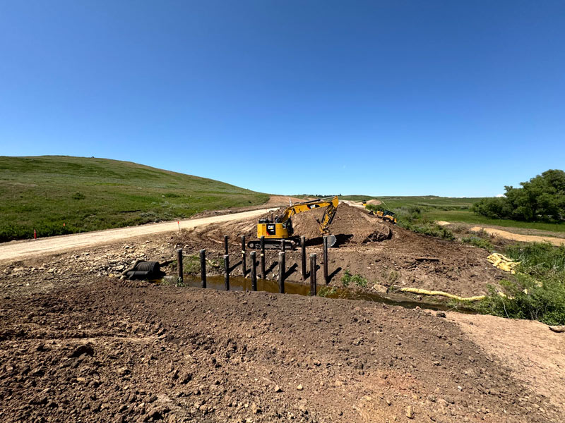 Crews working on the bridge embankments. (Bridge #6101)