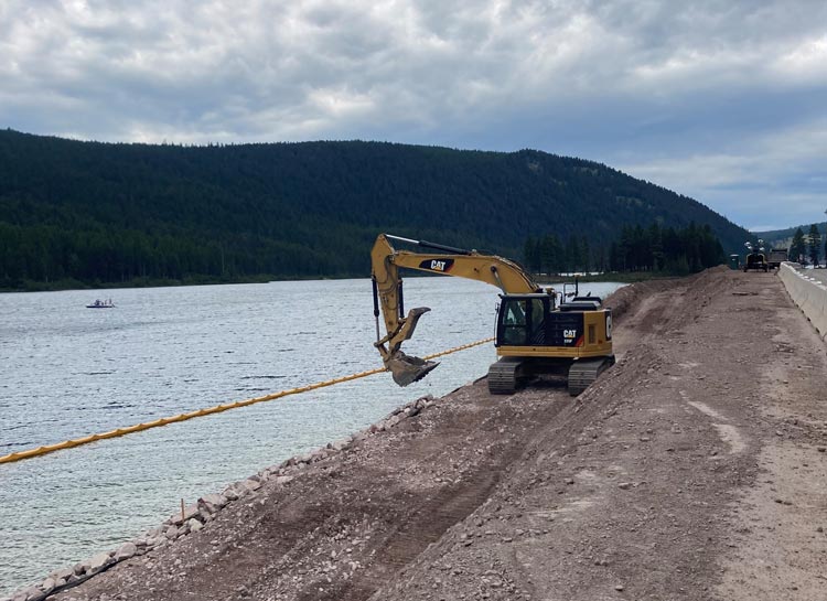 Installing riprap along Salmon Lake