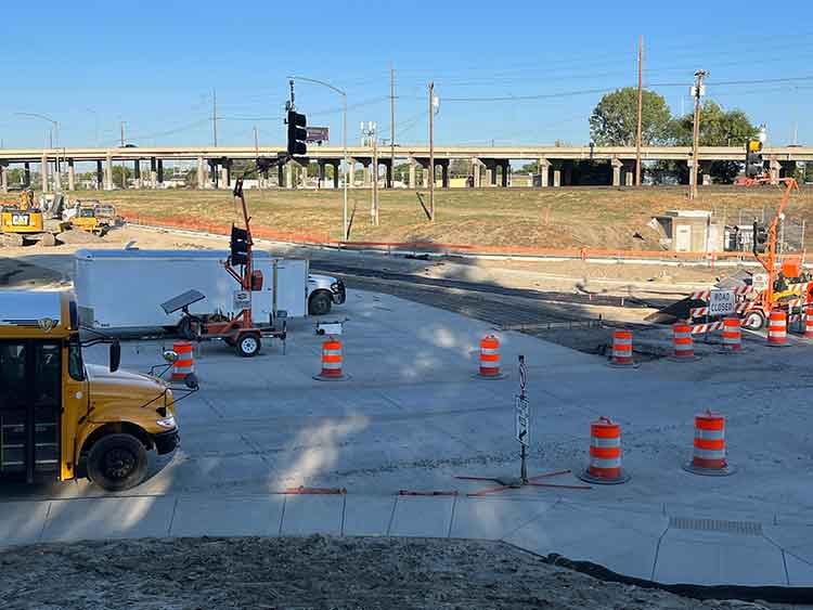 A view of the State Avenue and Underpass Avenue intersection; resurfacing work in progress.