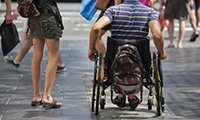 close up of wheelchair crossing street