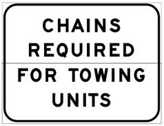 road sign that reads: chains required for towing units